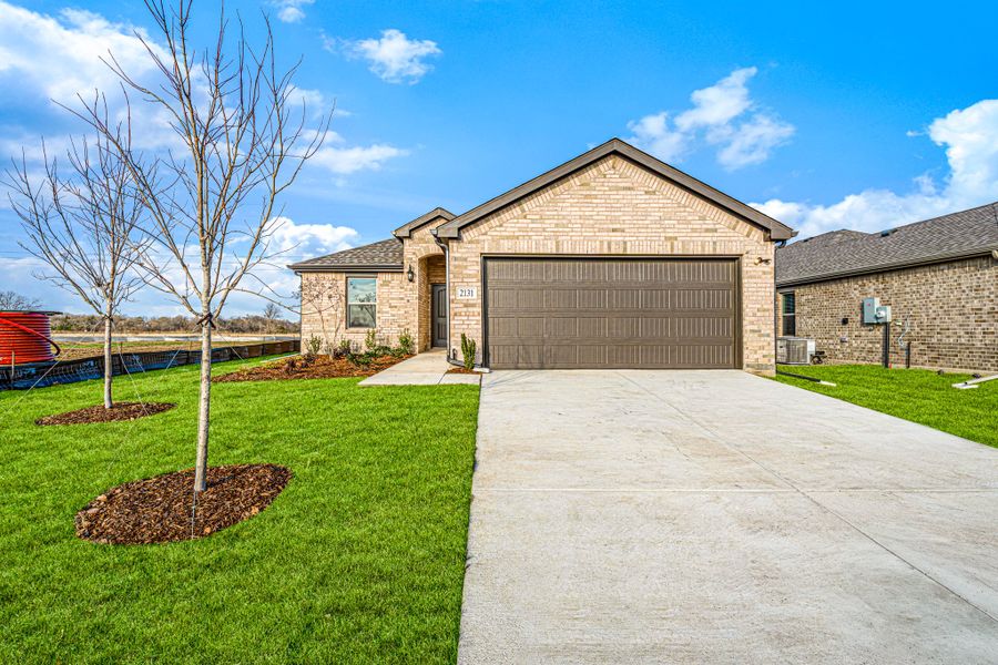 Front exterior of a new home in Stonecreek, Sulphur Springs, TX, highlighting curb appeal (Image 25).