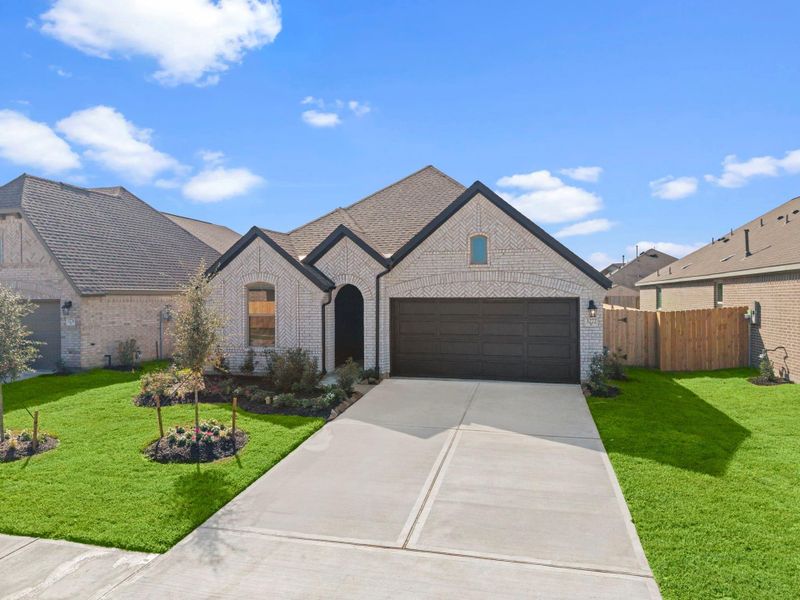 Front exterior of a new home in , Spring, TX, highlighting curb appeal (Image 16). Front exterior of a new home in , Spring, TX, highlighting curb appeal (Image 16).