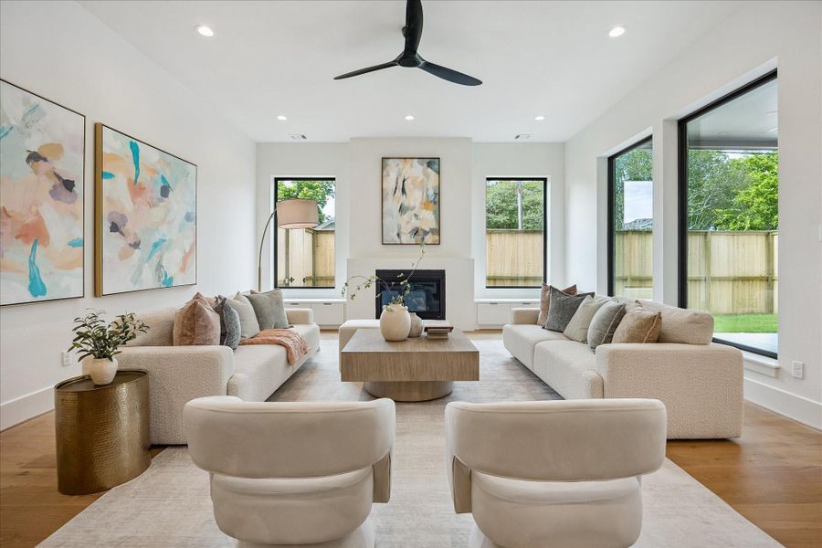 Living room – features a gas fireplace with custom built-ins on either side. Living room – features a gas fireplace with custom built-ins on either side.