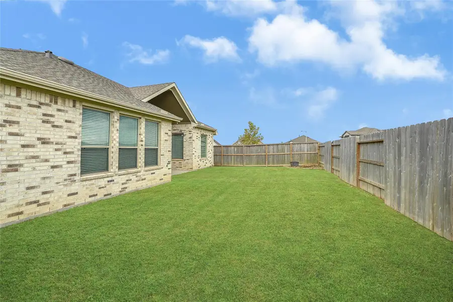 Front exterior of a new home in Lago Mar, Texas City, TX, highlighting curb appeal (Image 2). Front exterior of a new home in Lago Mar, Texas City, TX, highlighting curb appeal (Image 2).