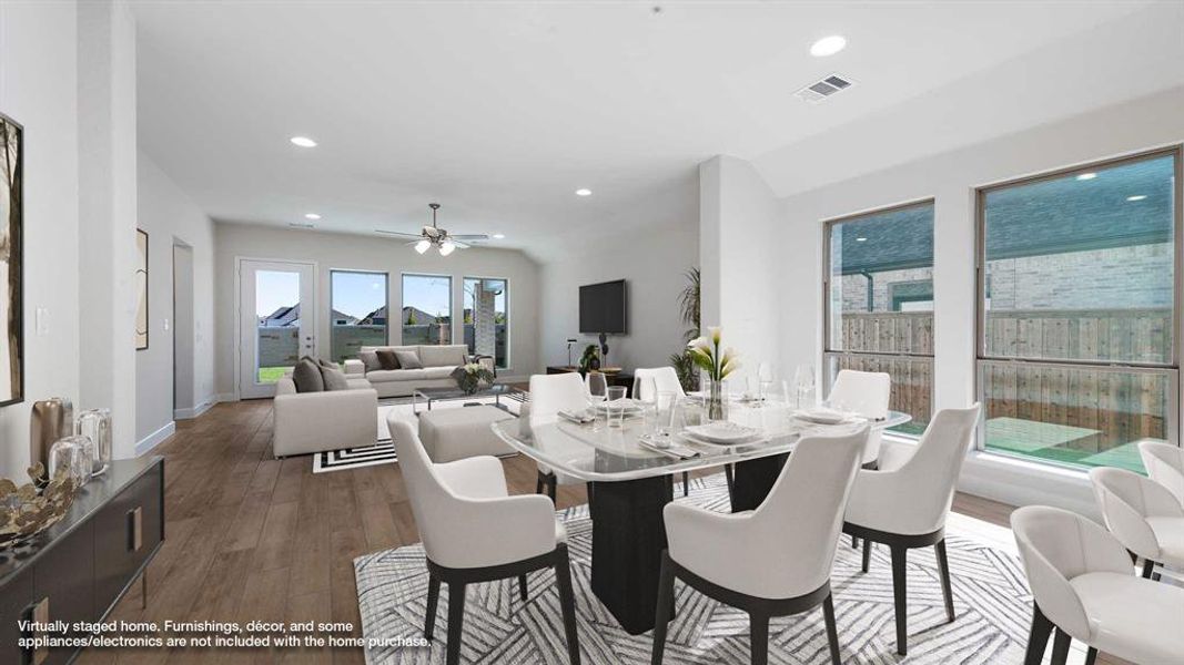 Dining area featuring hardwood / wood-style flooring and ceiling fan