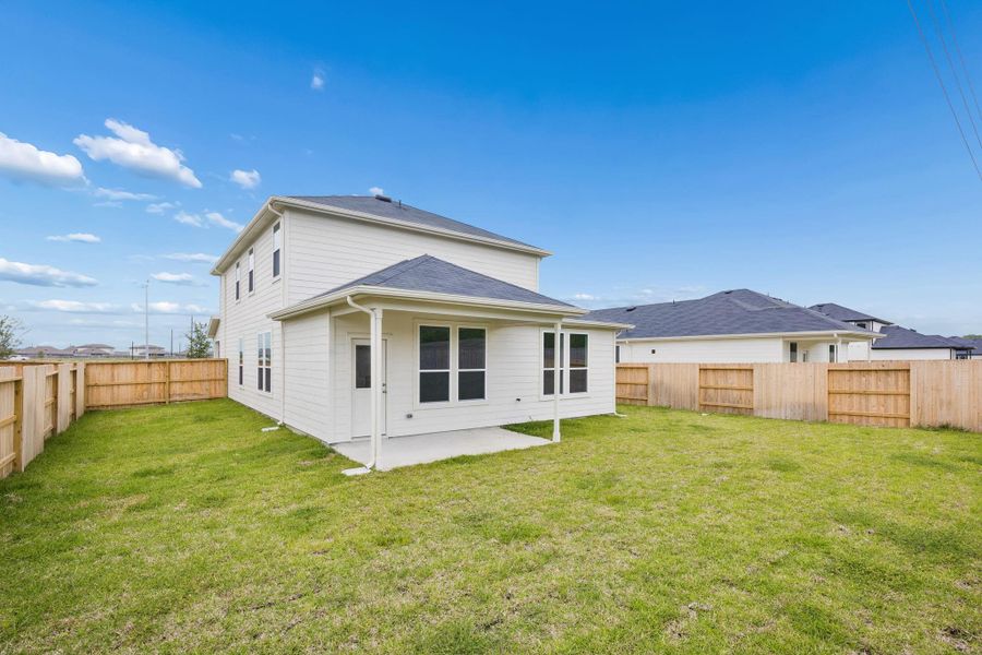 Exterior details and patio area of a home in Windcress, Cove (Image 3).