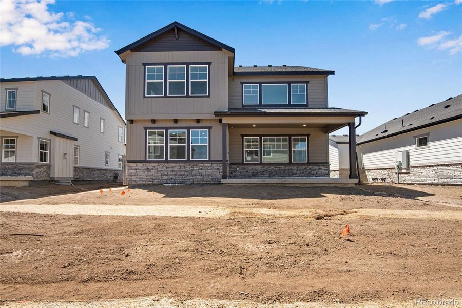Front exterior of a new home in Prelude at The Aurora Highlands, Aurora, CO, highlighting curb appeal (Image 29).