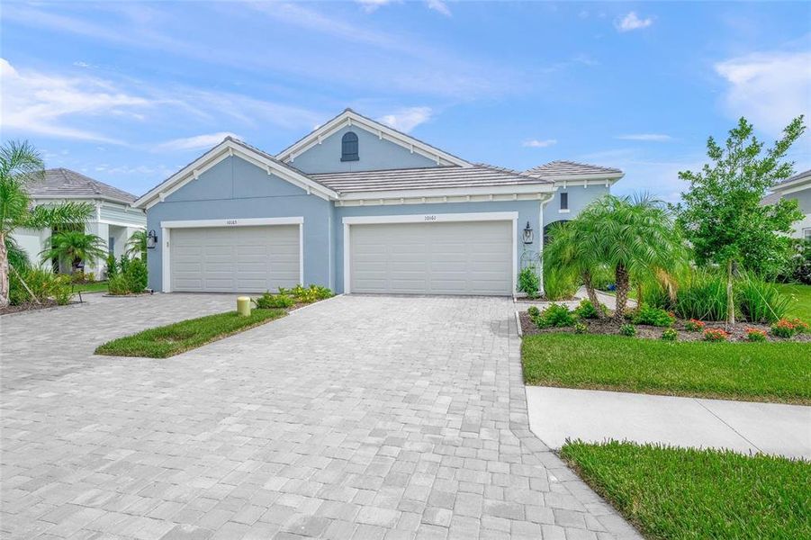 Front exterior of a new home in , Sarasota, FL, highlighting curb appeal (Image 21). Front exterior of a new home in , Sarasota, FL, highlighting curb appeal (Image 21).