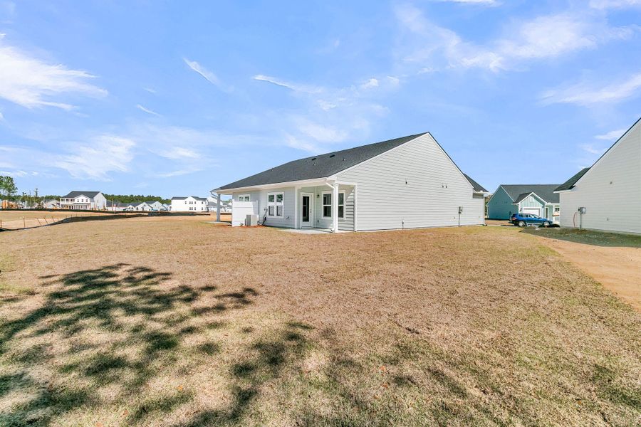 Exterior details and patio area of a home in , Ravenel (Image 21).