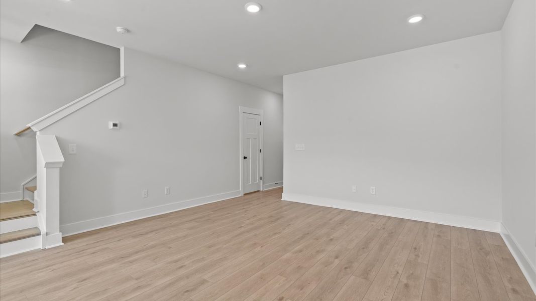 Superior design shines in this open-concept family room with timeless finishes and a modern edge