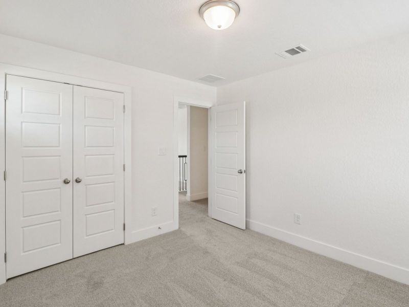 Guest bedroom in the Matador floorplan at a Meritage Homes community. Guest bedroom in the Matador floorplan at a Meritage Homes community.
