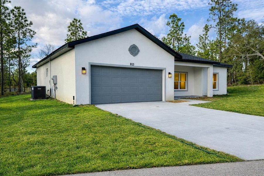 Front exterior of a new home in , Citrus Springs, FL, highlighting curb appeal (Image 24). Front exterior of a new home in , Citrus Springs, FL, highlighting curb appeal (Image 24).