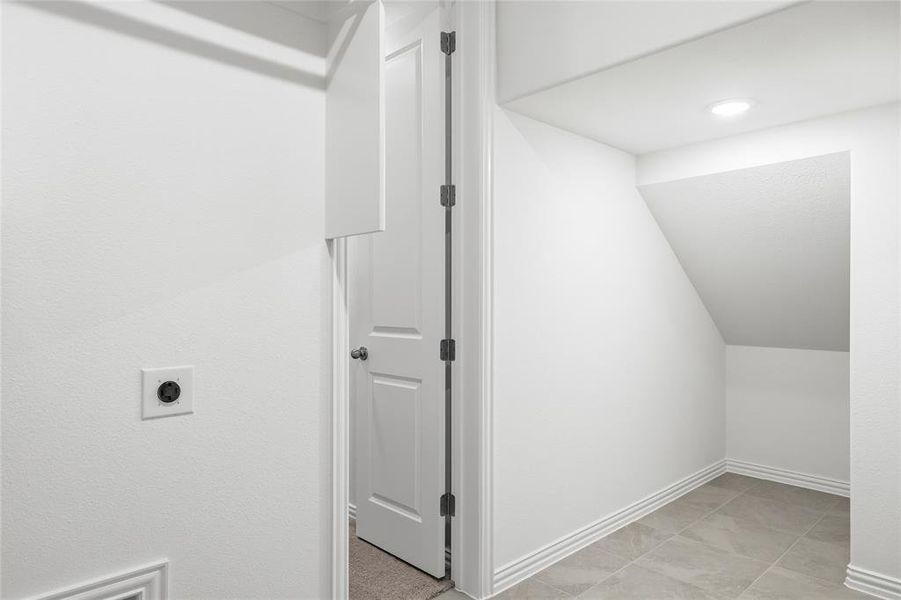 Bright room featuring dark wood-finish flooring, white walls, and recessed lighting