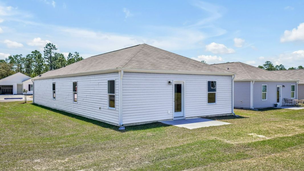 Front exterior of a new home in Lockwood Landing, Supply, NC, highlighting curb appeal (Image 15).