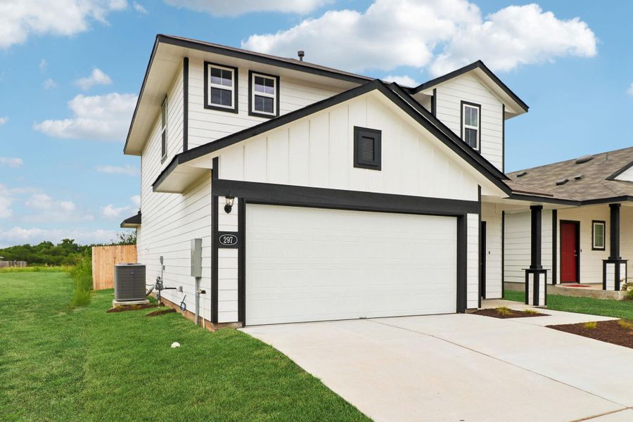 Front exterior of a new home in Hymeadow, San Marcos, TX, highlighting curb appeal (Image 1). Front exterior of a new home in Hymeadow, San Marcos, TX, highlighting curb appeal (Image 1).
