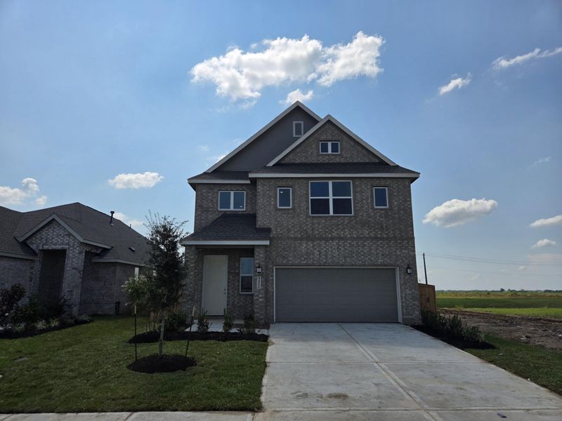 Front exterior of a new home in Esperanza: Avante Collection, Richmond, TX, highlighting curb appeal (Image 1). Front exterior of a new home in Esperanza: Avante Collection, Richmond, TX, highlighting curb appeal (Image 1).