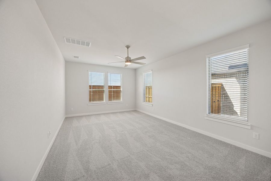 Primary Suite in the Wimbledon home plan by Trophy Signature Homes – REPRESENTATIVE PHOTO