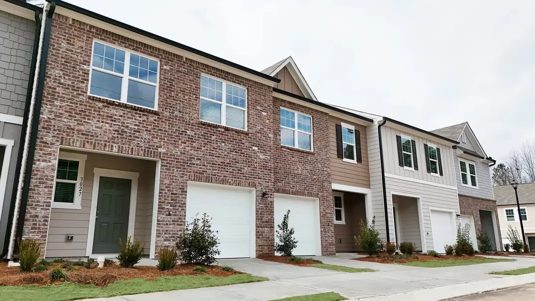Front exterior of a new home in Kingston Cove, Auburn, GA, highlighting curb appeal (Image 1). Front exterior of a new home in Kingston Cove, Auburn, GA, highlighting curb appeal (Image 1).
