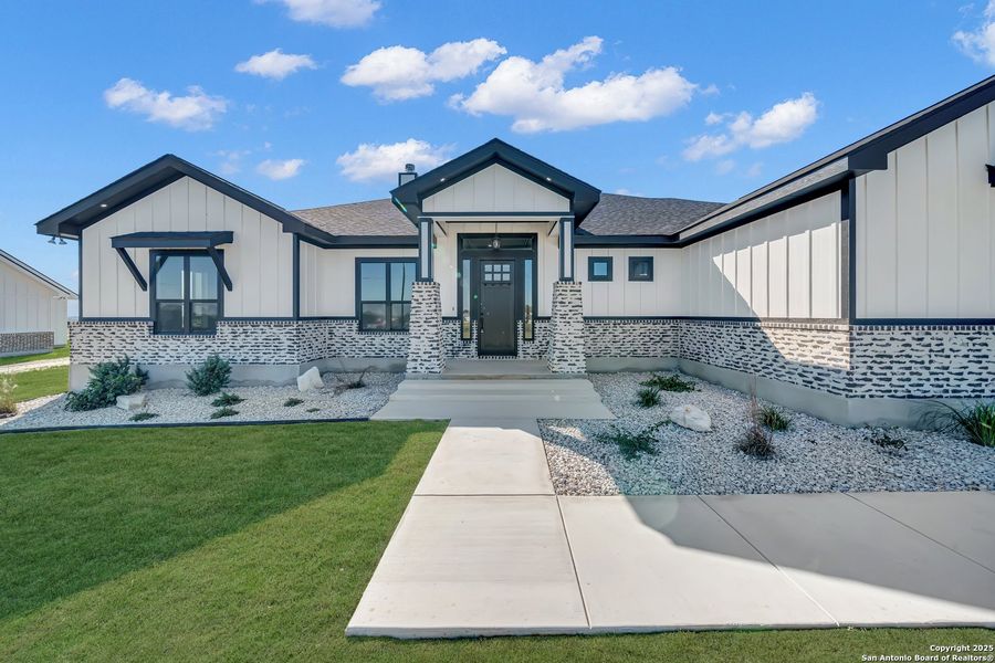 Front exterior of a new home in , La Vernia, TX, highlighting curb appeal (Image 31).