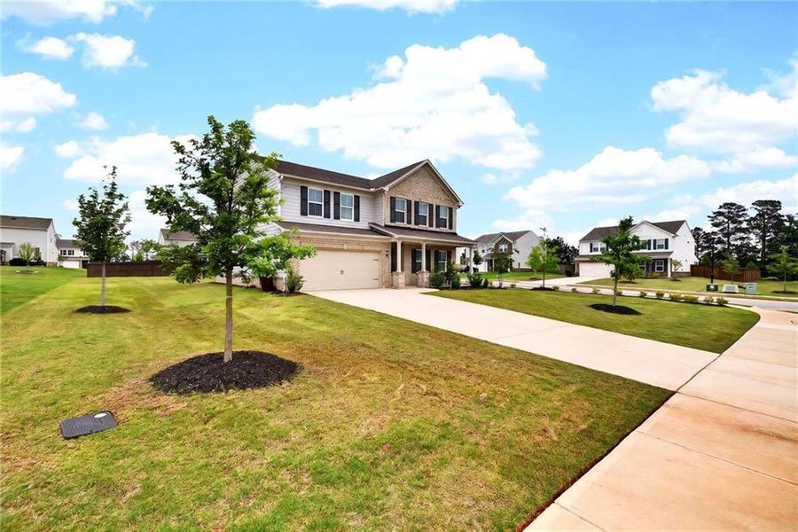 Front exterior of a new home in , McDonough, GA, highlighting curb appeal (Image 25).