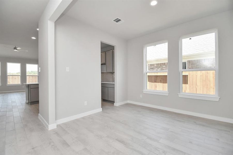 Another view of the dining space. Sample photo of completed home with similar floor plan. Actual colors and selections may vary.