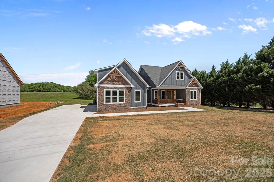 Front exterior of a new home in , Statesville, NC, highlighting curb appeal (Image 15). Front exterior of a new home in , Statesville, NC, highlighting curb appeal (Image 15).