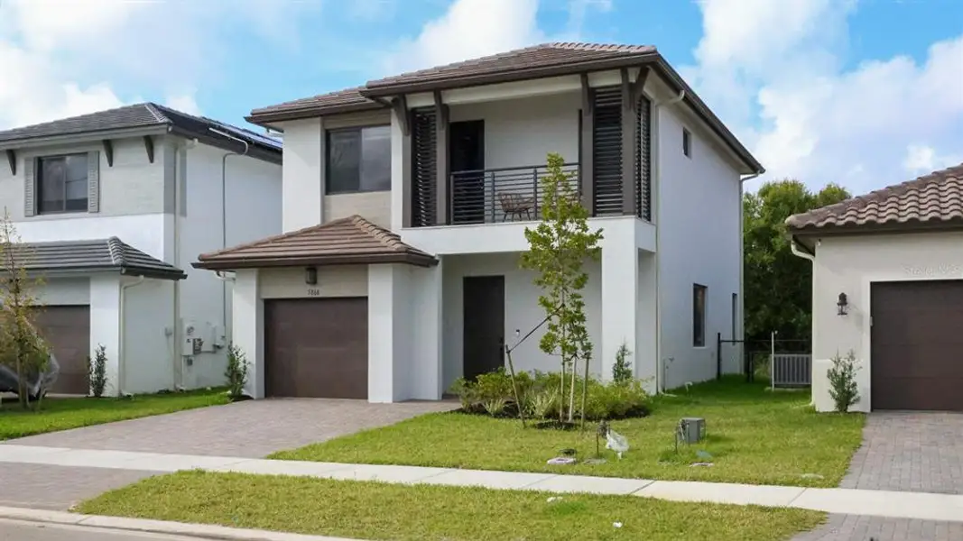 Front exterior of a new home in , Ave Maria, FL, highlighting curb appeal (Image 2). Front exterior of a new home in , Ave Maria, FL, highlighting curb appeal (Image 2).