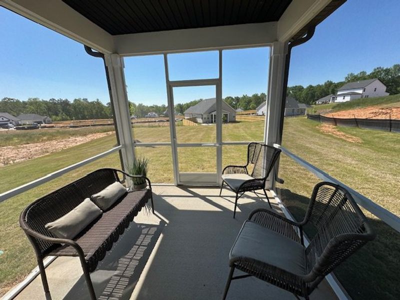 This screened porch provides a peaceful outdoor re