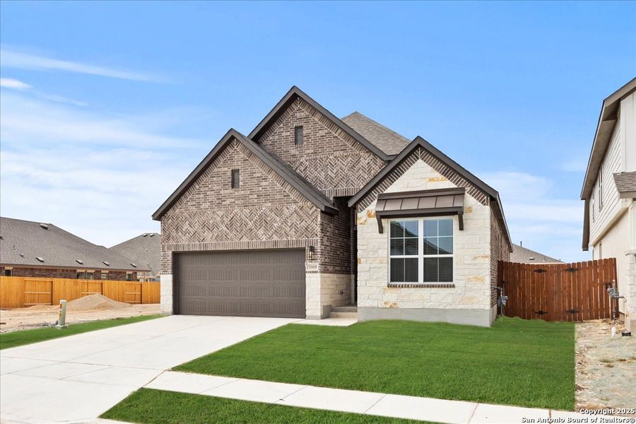 Front exterior of a new home in Meyer Ranch, New Braunfels, TX, highlighting curb appeal (Image 12). Front exterior of a new home in Meyer Ranch, New Braunfels, TX, highlighting curb appeal (Image 12).