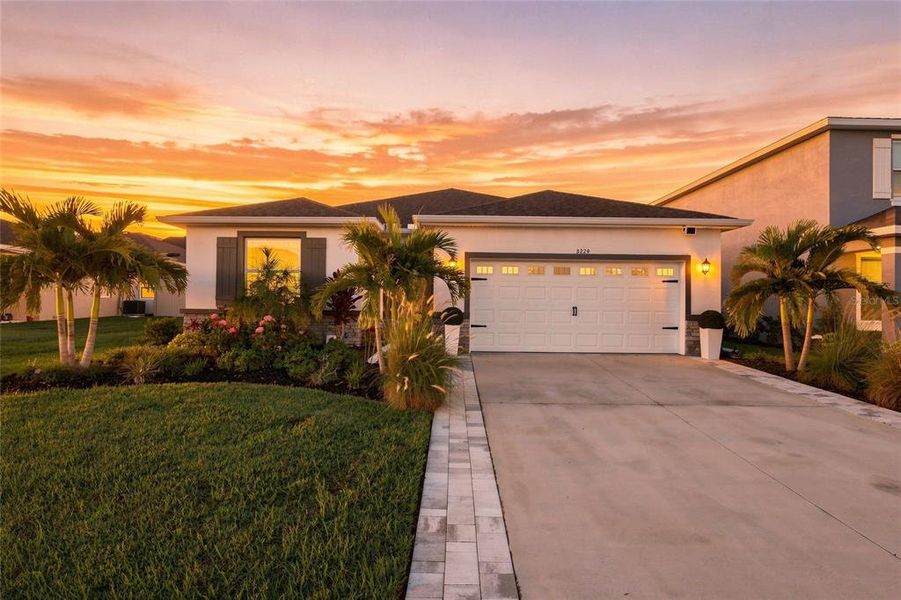 Front exterior of a new home in , Lakewood Ranch, FL, highlighting curb appeal (Image 2).