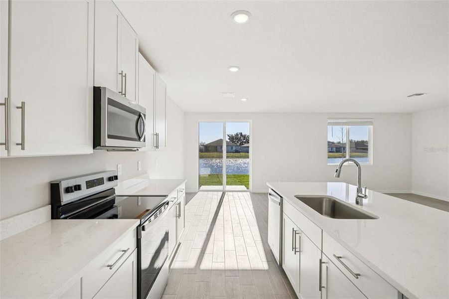 Furnished interior view inside a new home in The Grove at Stuart Crossing - Classic Series, Bartow (Image 8).