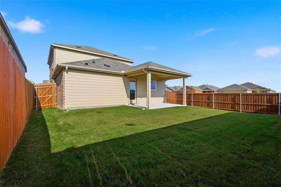 Rear view of property featuring a patio, a fenced backyard, and a gate Rear view of property featuring a patio, a fenced backyard, and a gate