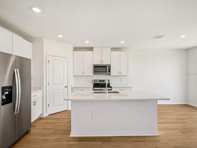 Furnished interior view inside a new home in The Reserve at Van Oaks, Auburndale (Image 10).