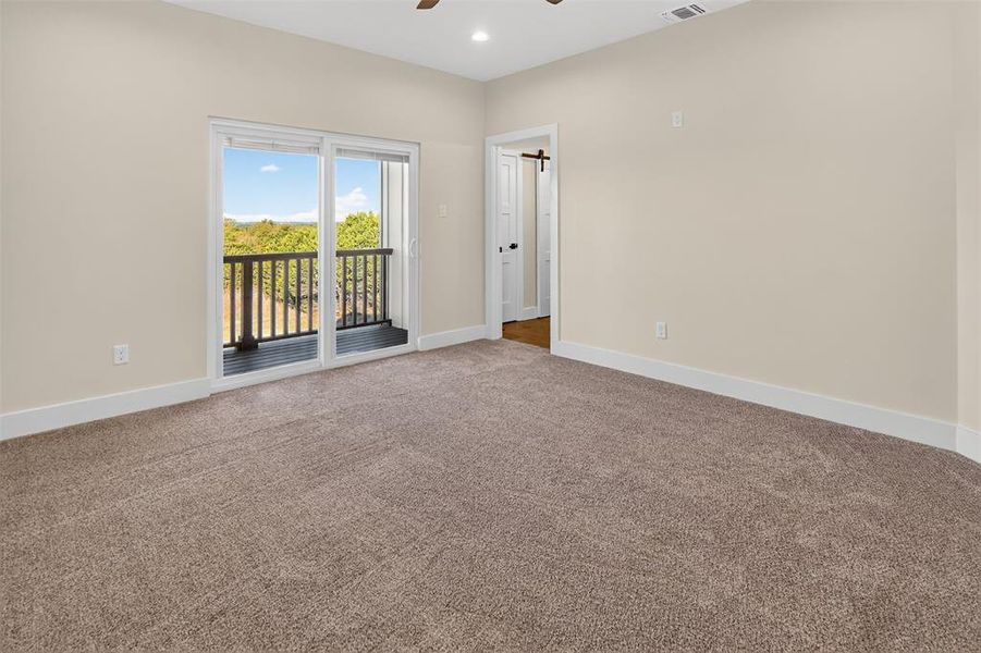 primary bedroom  with balcony and ensuite bathroom