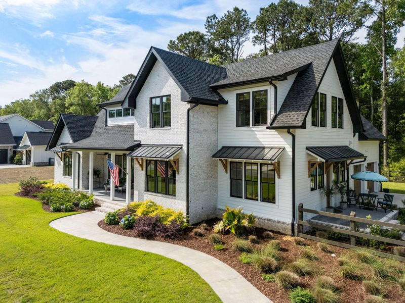 Front exterior of a new home in , Johns Island, SC, highlighting curb appeal (Image 20). Front exterior of a new home in , Johns Island, SC, highlighting curb appeal (Image 20).