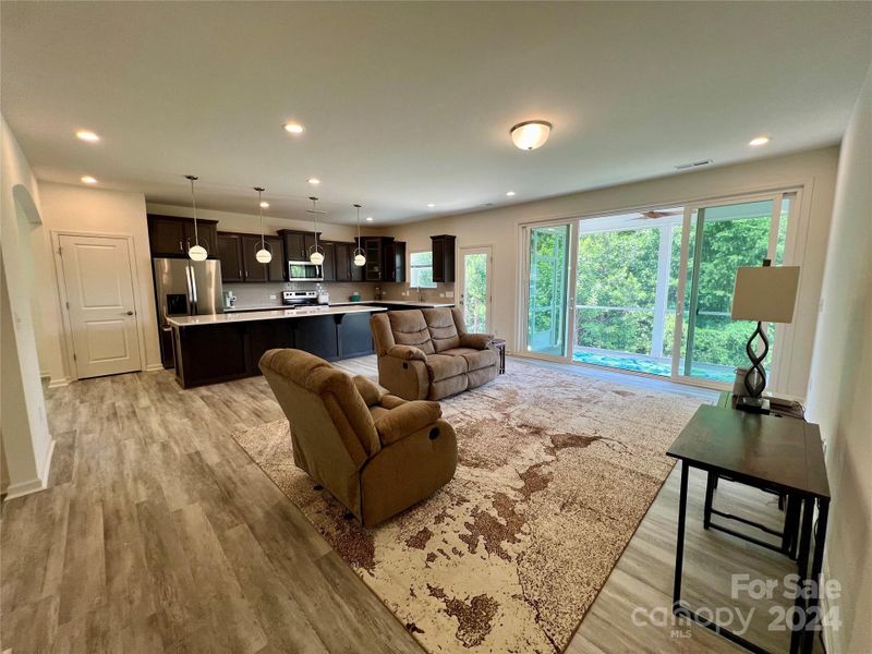 Family room with great views to back wooded area.