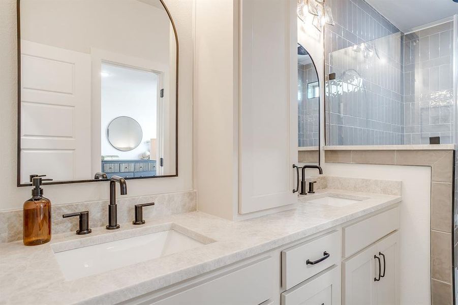 Spacious dual vanity offers abundant storage and contemporary style. Spacious dual vanity offers abundant storage and contemporary style.