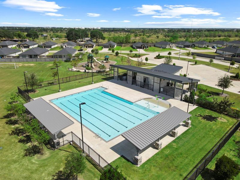 Aerial shot highlighting the large pool, modern clubhouse, and surrounding recreational spaces — beautifully maintained for residents to enjoy. Aerial shot highlighting the large pool, modern clubhouse, and surrounding recreational spaces — beautifully maintained for residents to enjoy.