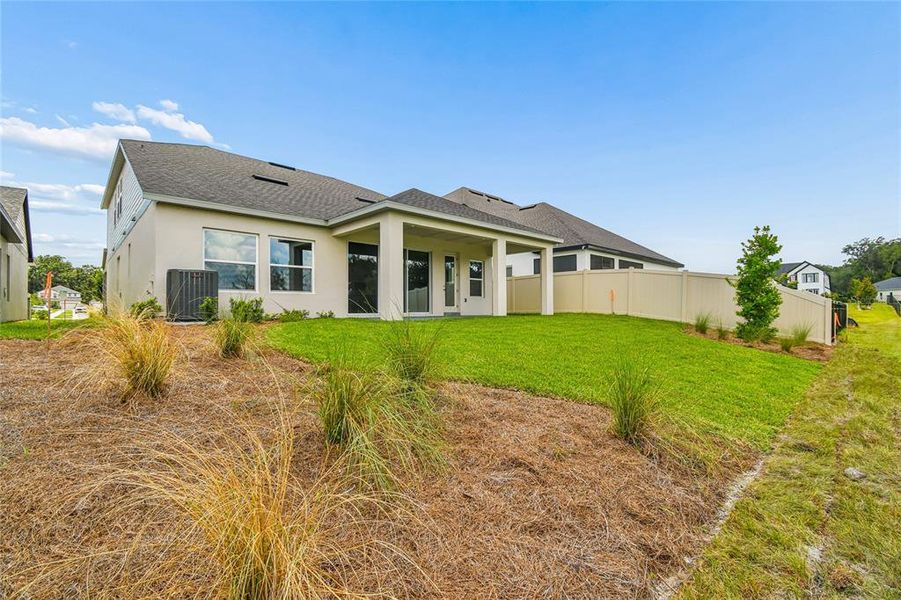 Exterior details and patio area of a home in Oakfield at Mount Dora Village Series, Mount Dora (Image 29).