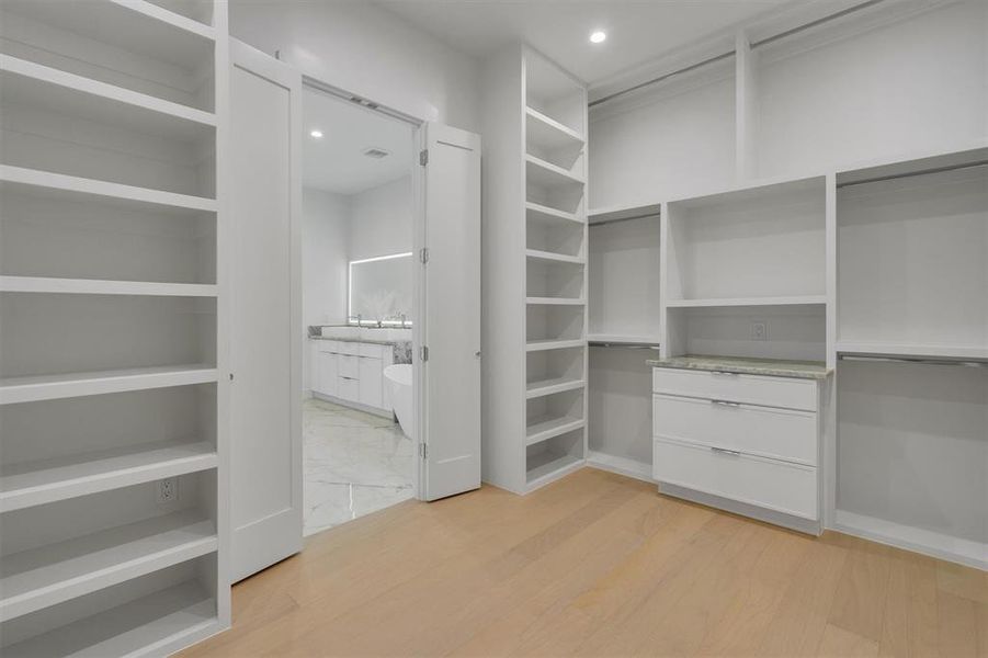 Walk in closet featuring light wood finished floors