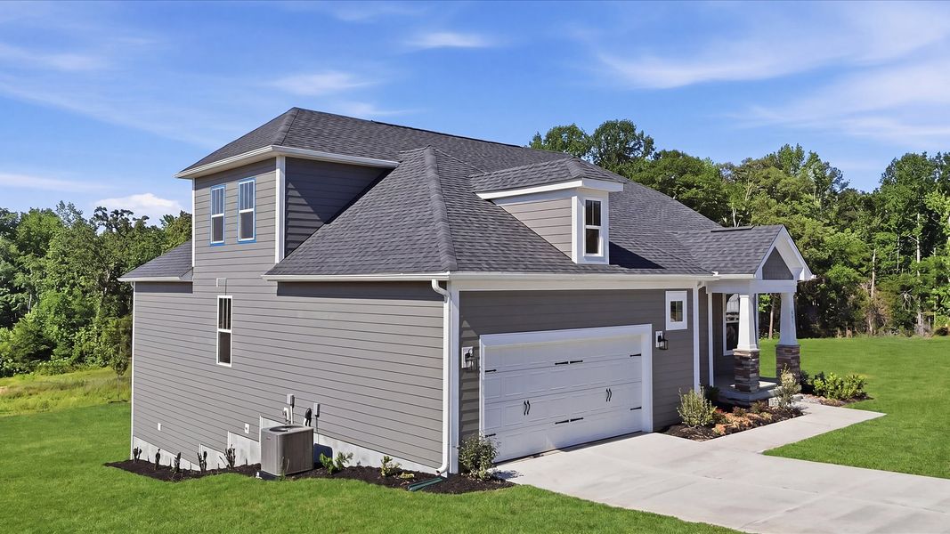 Front exterior of a new home in Pinebrook, Woodruff, SC, highlighting curb appeal (Image 2). Front exterior of a new home in Pinebrook, Woodruff, SC, highlighting curb appeal (Image 2).