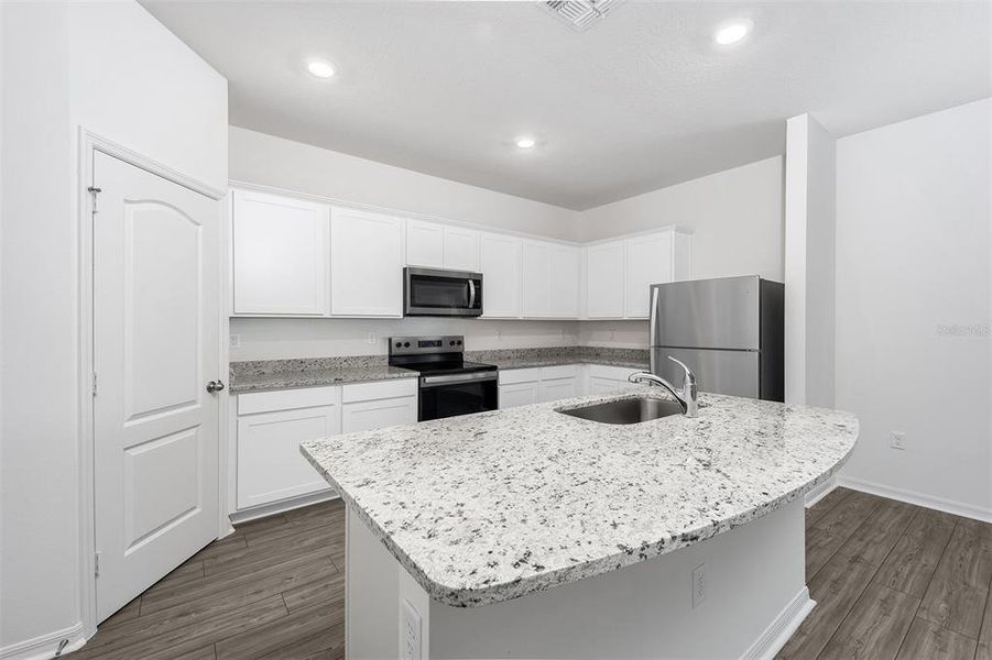 Furnished interior view inside a new home in Tula Parc, Astatula (Image 6).