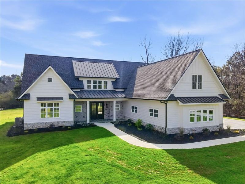 Front exterior of a new home in , Canton, GA, highlighting curb appeal (Image 2).