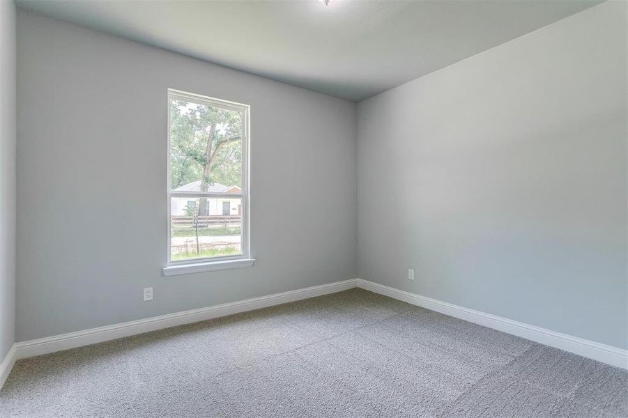 Unfurnished room featuring carpet flooring