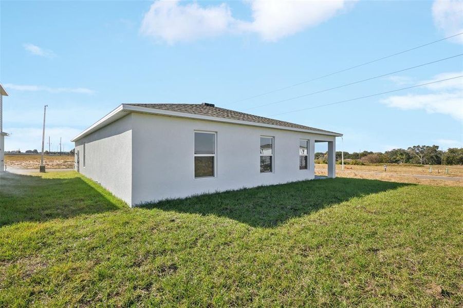 Exterior details and patio area of a home in The Enclave at Scenic Terrace, Haines City (Image 11).