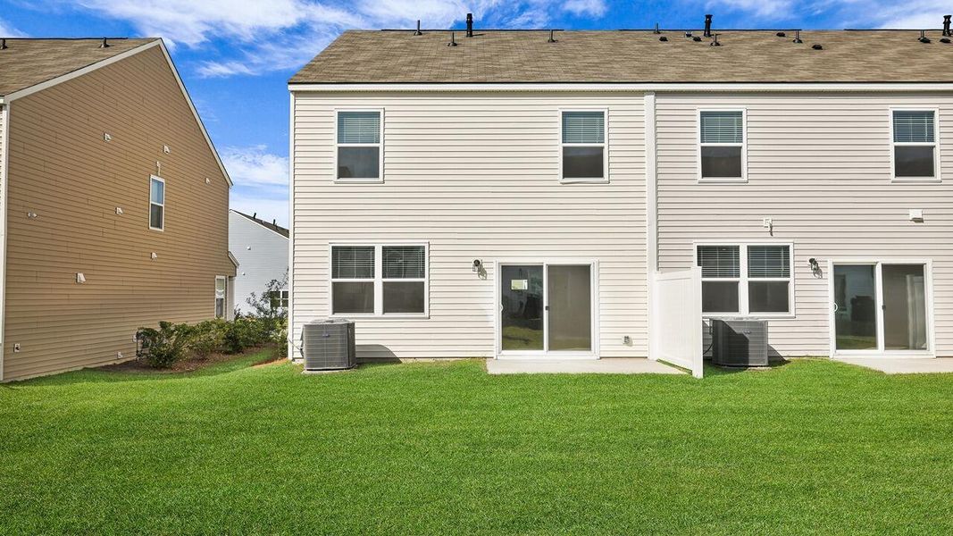 Exterior details and patio area of a home in Carolina Groves Townhomes, Moncks Corner (Image 2). Exterior details and patio area of a home in Carolina Groves Townhomes, Moncks Corner (Image 2).