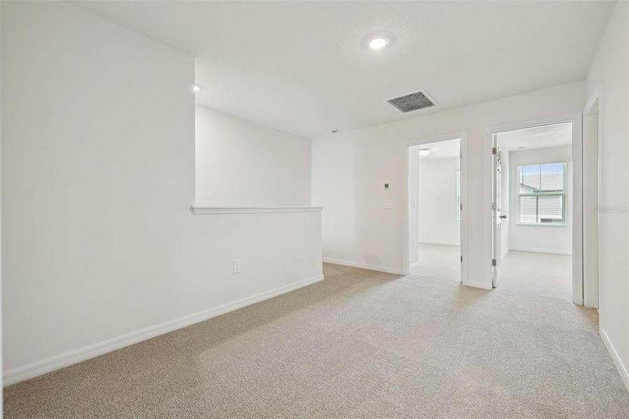 Spacious, unfurnished interior of a new home in Cagan Crossings West, Clermont (Image 23).