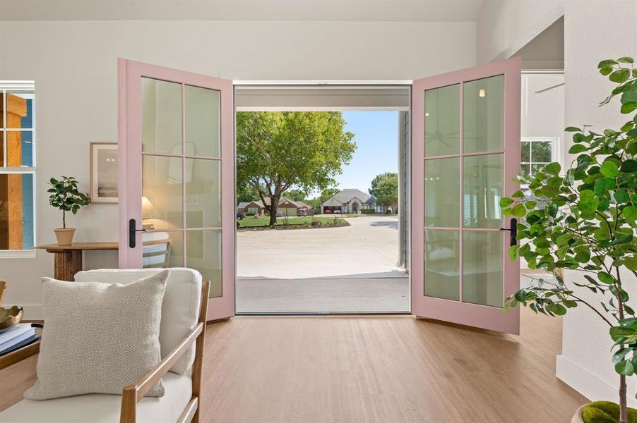Entryway with french doors and wood finished floors Entryway with french doors and wood finished floors