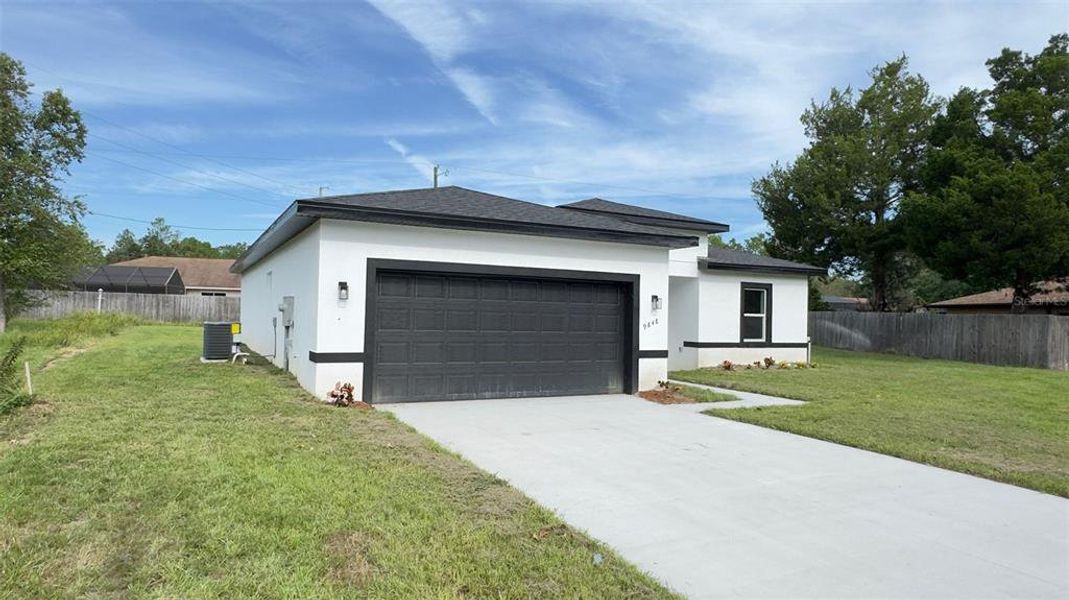 Front exterior of a new home in , Citrus Springs, FL, highlighting curb appeal (Image 1).