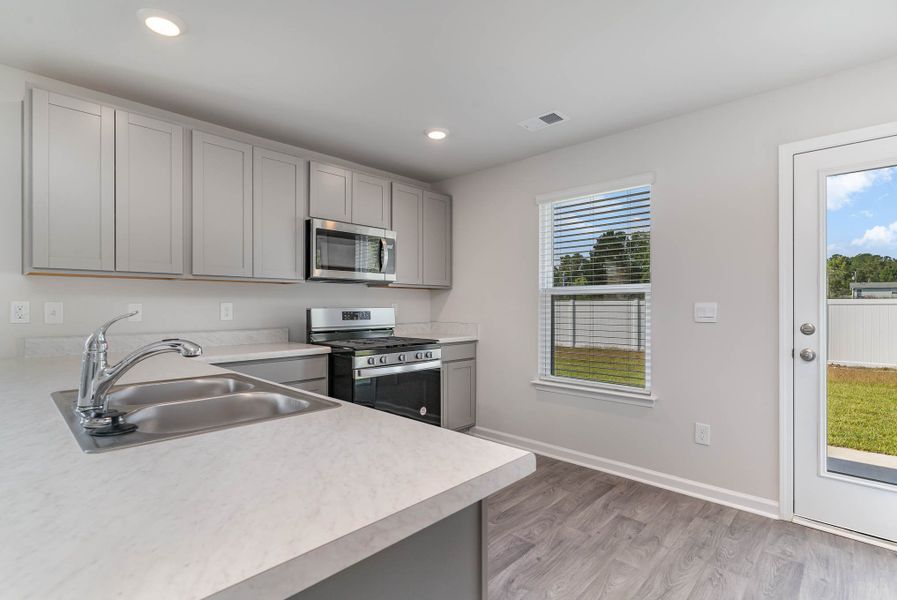Representative furnished interior of a home built from the Plan by D.R. Horton in Auberon Woods, Conway (Image 6). Representative furnished interior of a home built from the Plan by D.R. Horton in Auberon Woods, Conway (Image 6).