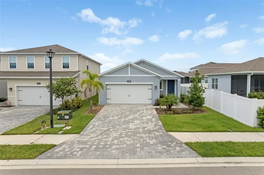 Front exterior of a new home in , Bradenton, FL, highlighting curb appeal (Image 19).