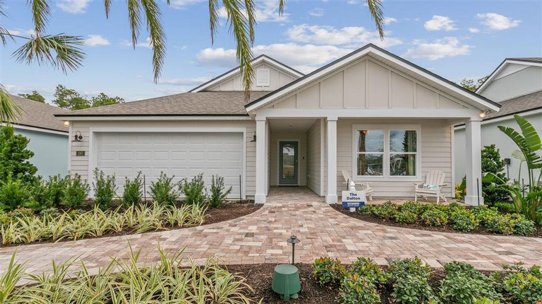 Front exterior of a new home in Sawmill Branch, Palm Coast, FL, highlighting curb appeal (Image 24).