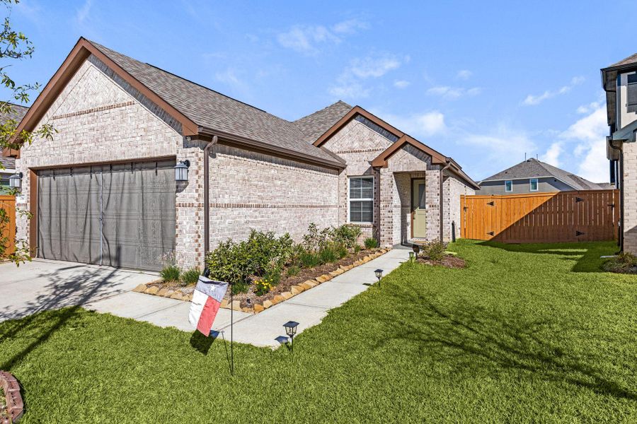 Front exterior of a new home in Marvida, Cypress, TX, highlighting curb appeal (Image 1).