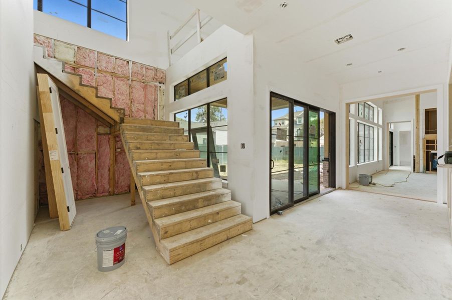 Windows and sliding glass doors provide ample natural light throughout the first floor.